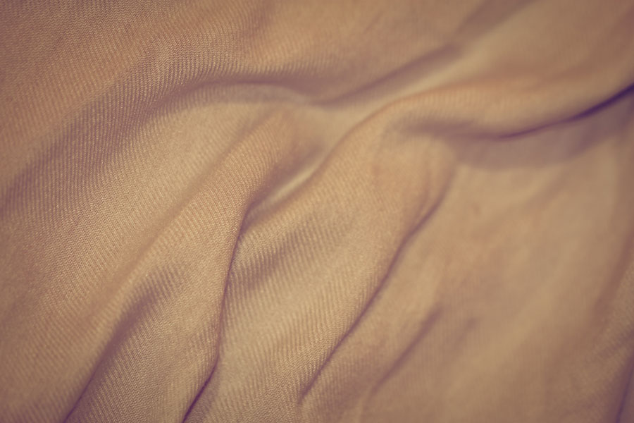 Pashmina Pink – Thumbnail of a soft peachy pink fabric texture with a slight sheen